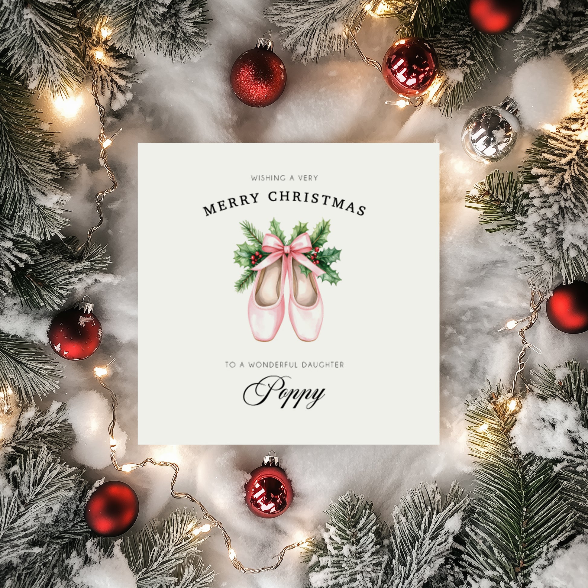 Personalised Christmas card with ballet shoes surrounded by festive decorations on a snowy background