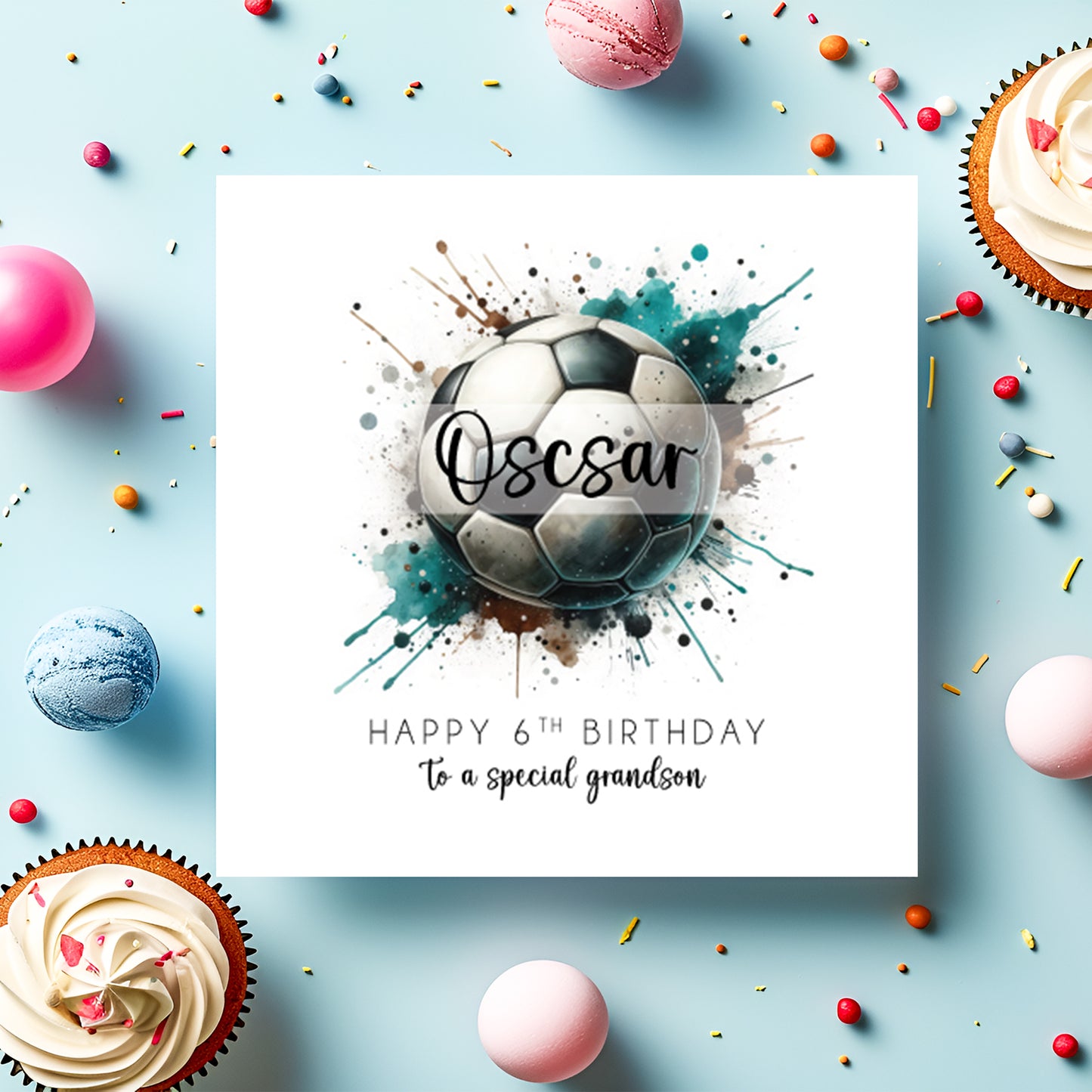 Birthday card with soccer ball design and colourful splashes and balloons on a light blue background