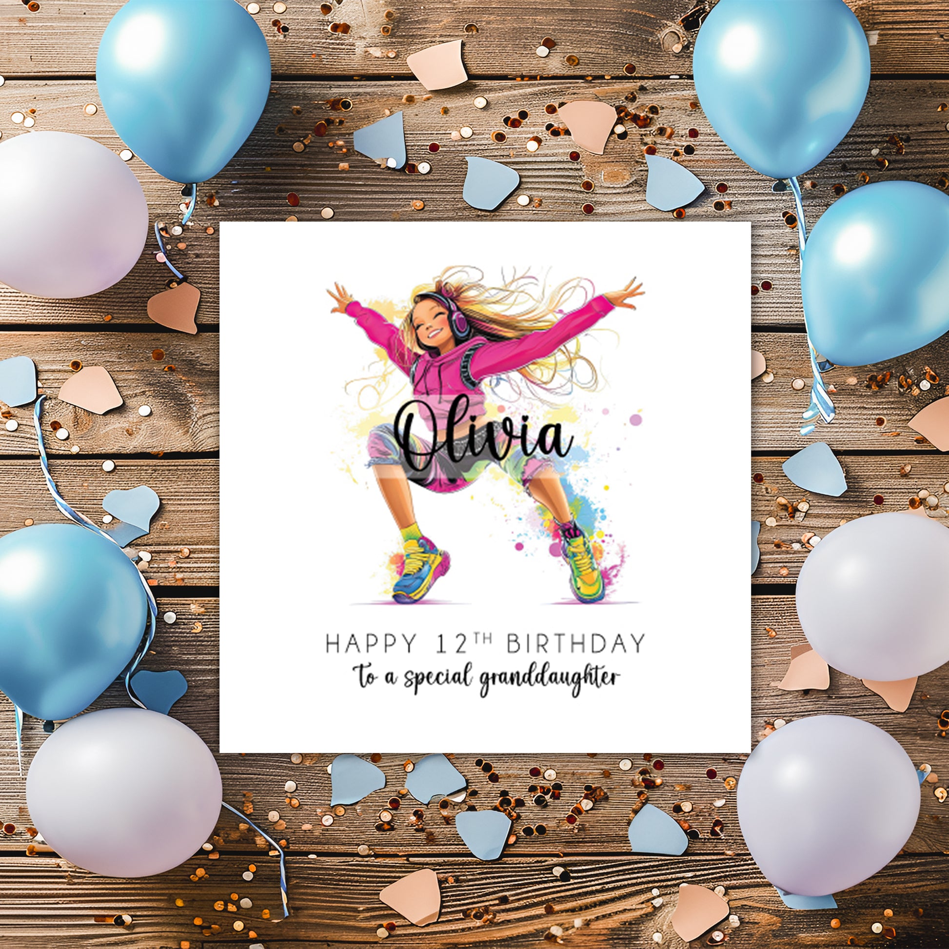 Birthday card with a personalised illustration of a girl dancing with headphones placed on a wooden background.