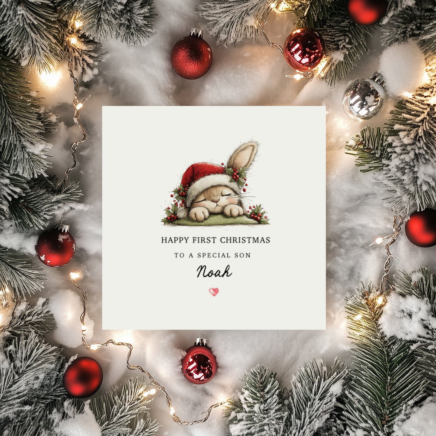 Personalised first Christmas card with a bunny wearing a Santa hat. Text reads "Happy First Christmas To a special (relationship) (name) surrounded by festive decorations.