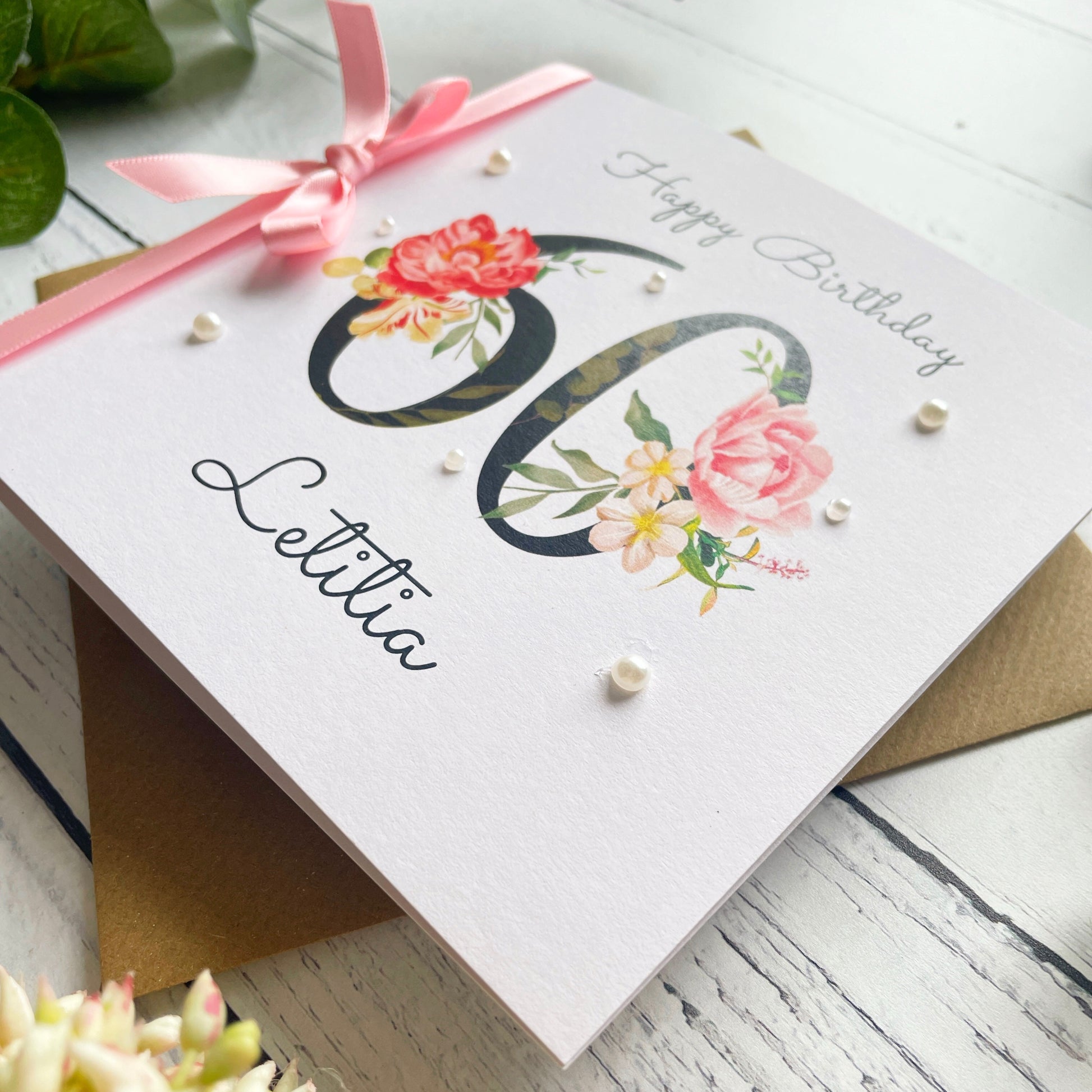 Birthday card with floral design, number 60, pink ribbon and pearls