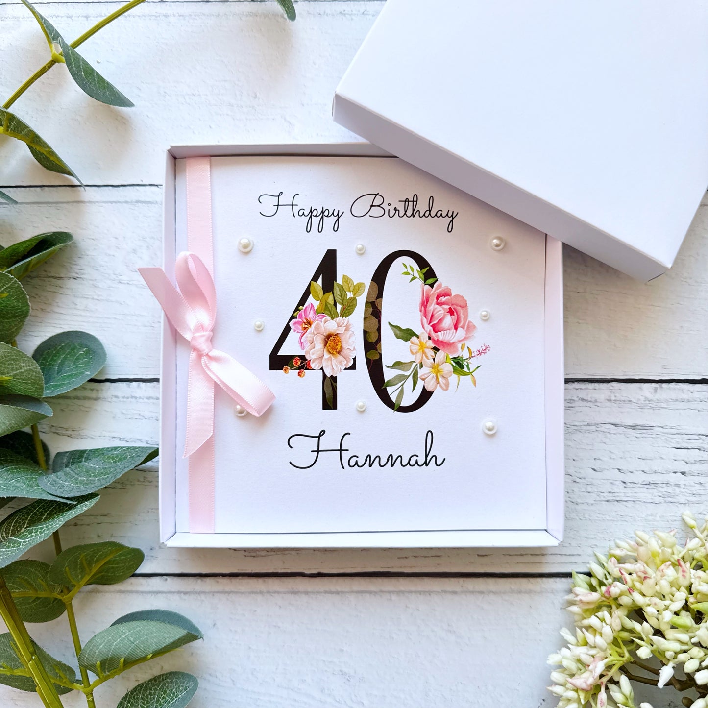 Birthday card with floral design and number 40 on a white background