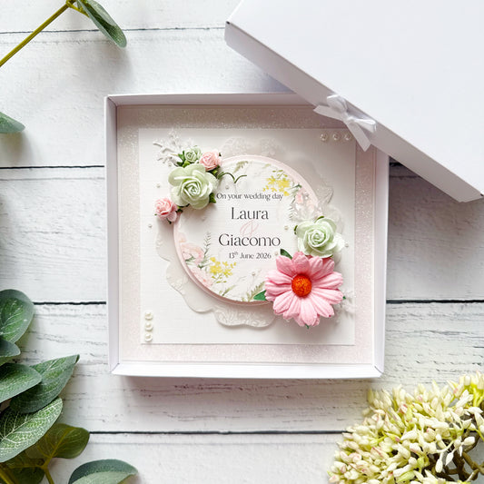 Personalised wedding card with 3d floral design in a box on a wooden surface