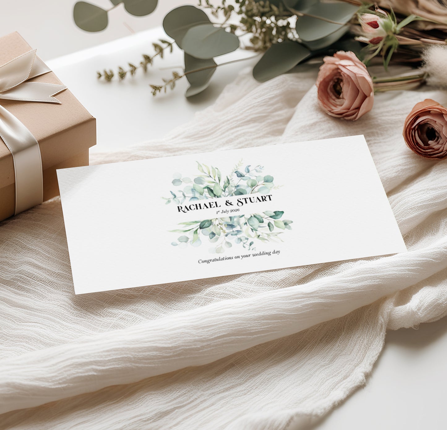 Sage green Wedding money wallet with greenery design with couples name and wedding date on a soft fabric background